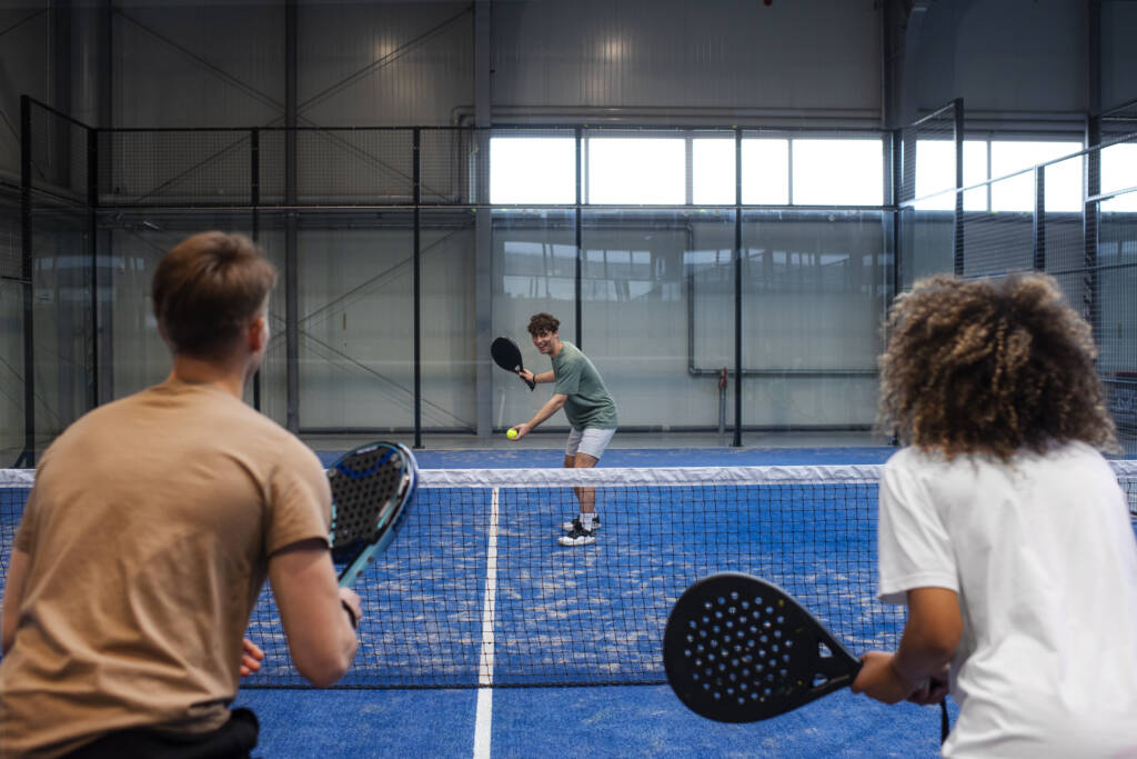 people-playing-padle-tennis-inside